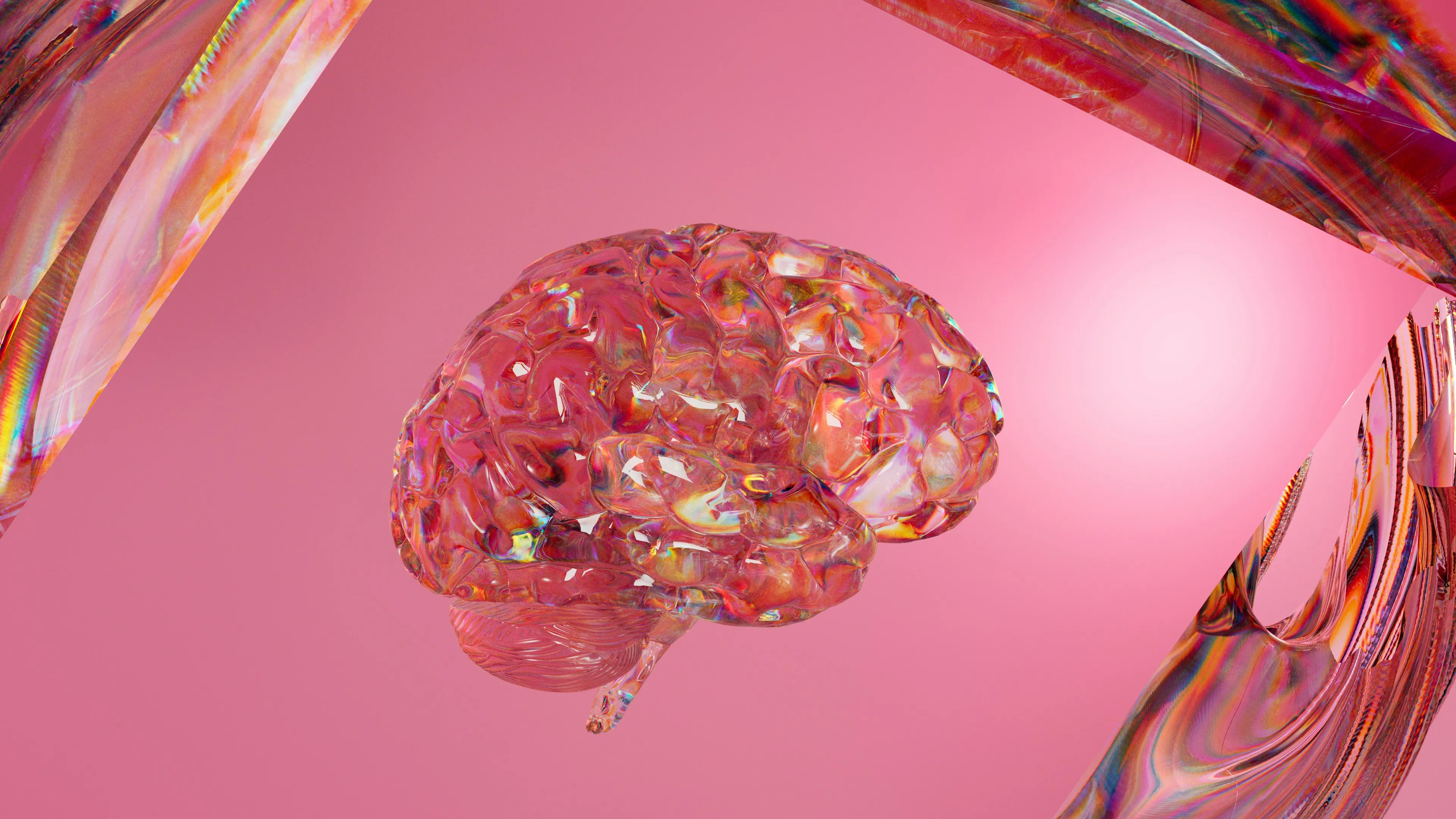 A glass brain suspended against pink, light refracting through it